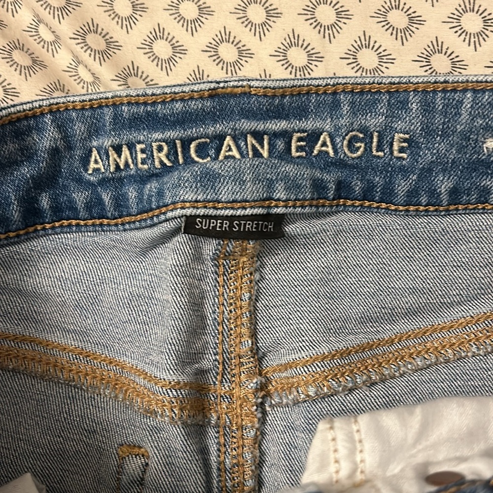 Hi Rise Distressed Jean Mini Skirt American Eagle - Picture 2 of 5
